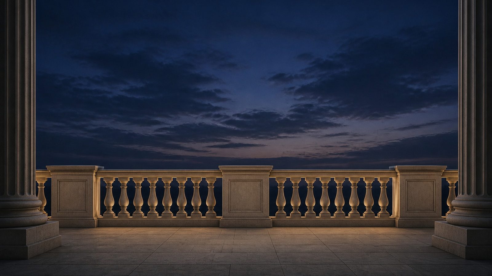 A lit stone colonnade and balustrade at dusk, overlooking open water.